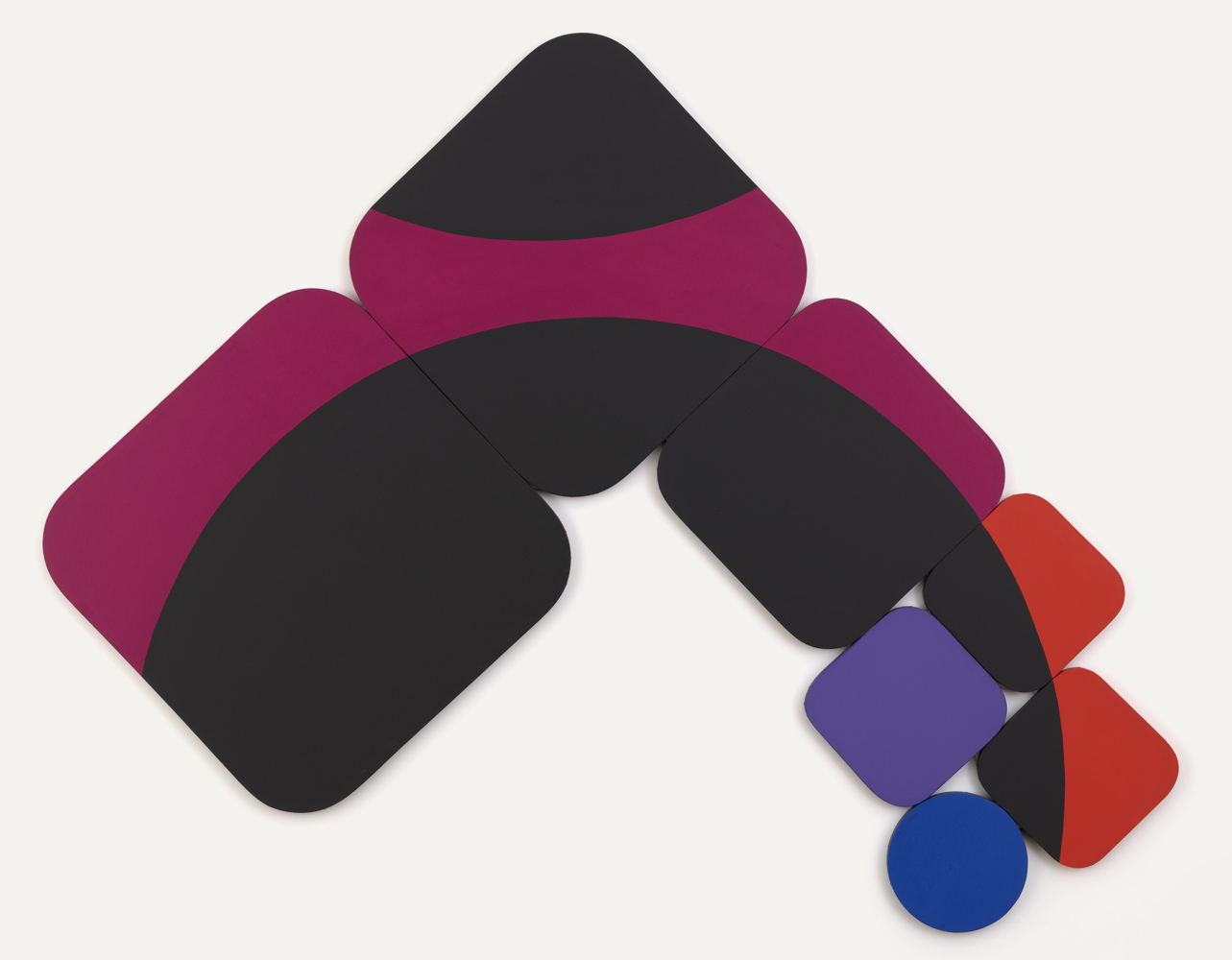 Many rounded square canvases of different sizes arranged to make a swooping shape defined further by a large black circle painted on the canvases which follows the arc of the canvases.  Beside the black is a fuchsia background which transitions to a brighter red at the bottom edge.  Also at the bottom edge are a purple rounded square, and a single circular 'accent' canvas, in a primary blue.