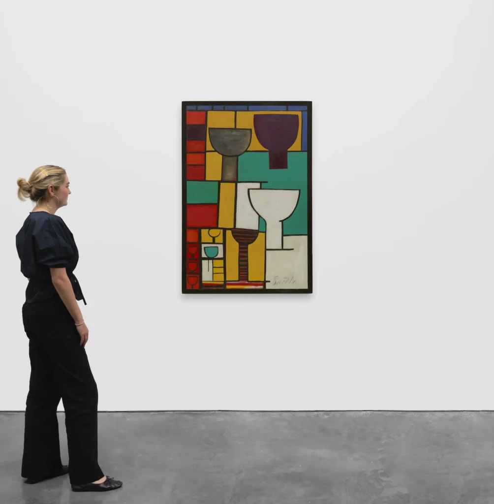 Repeated Forms, 1940. Artwork on a gallery wall with woman looking at artwork.