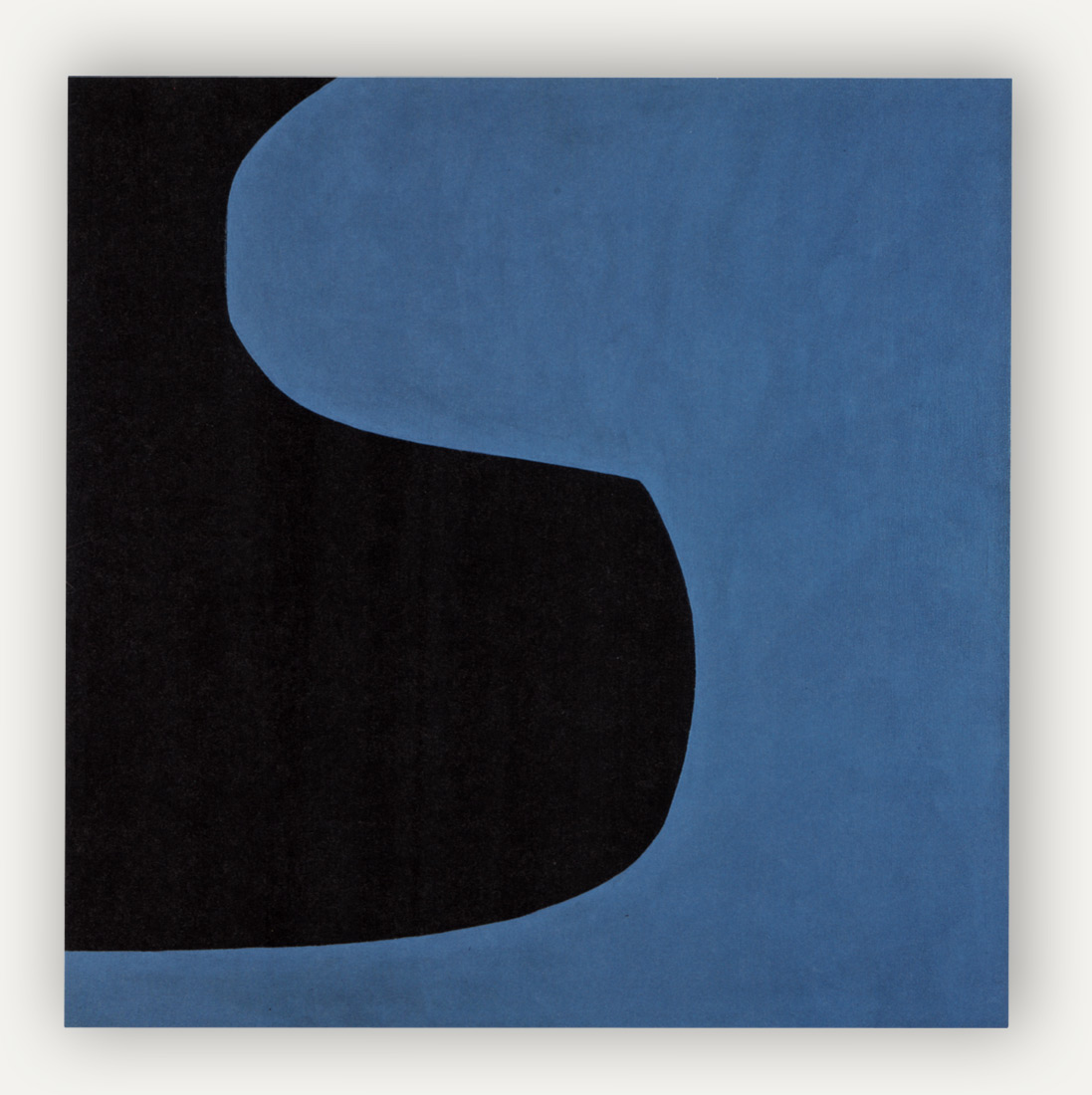 Square canvas with two shapes cutout to fit into each other perfectly, the black shape on the left protruded into the bottom half of the quare and the blue shape comes in from the top right, creating an S shape.