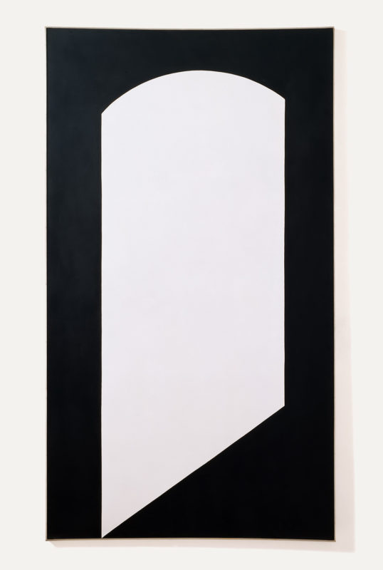 Black tall rectangular canvas, with a white irregular shape in the center. The shape is tall and rectangular on the sides but rounded on the top like an archway door-frame, the bottom left of the shape is pointed and extends to the bottom of the canvas.
