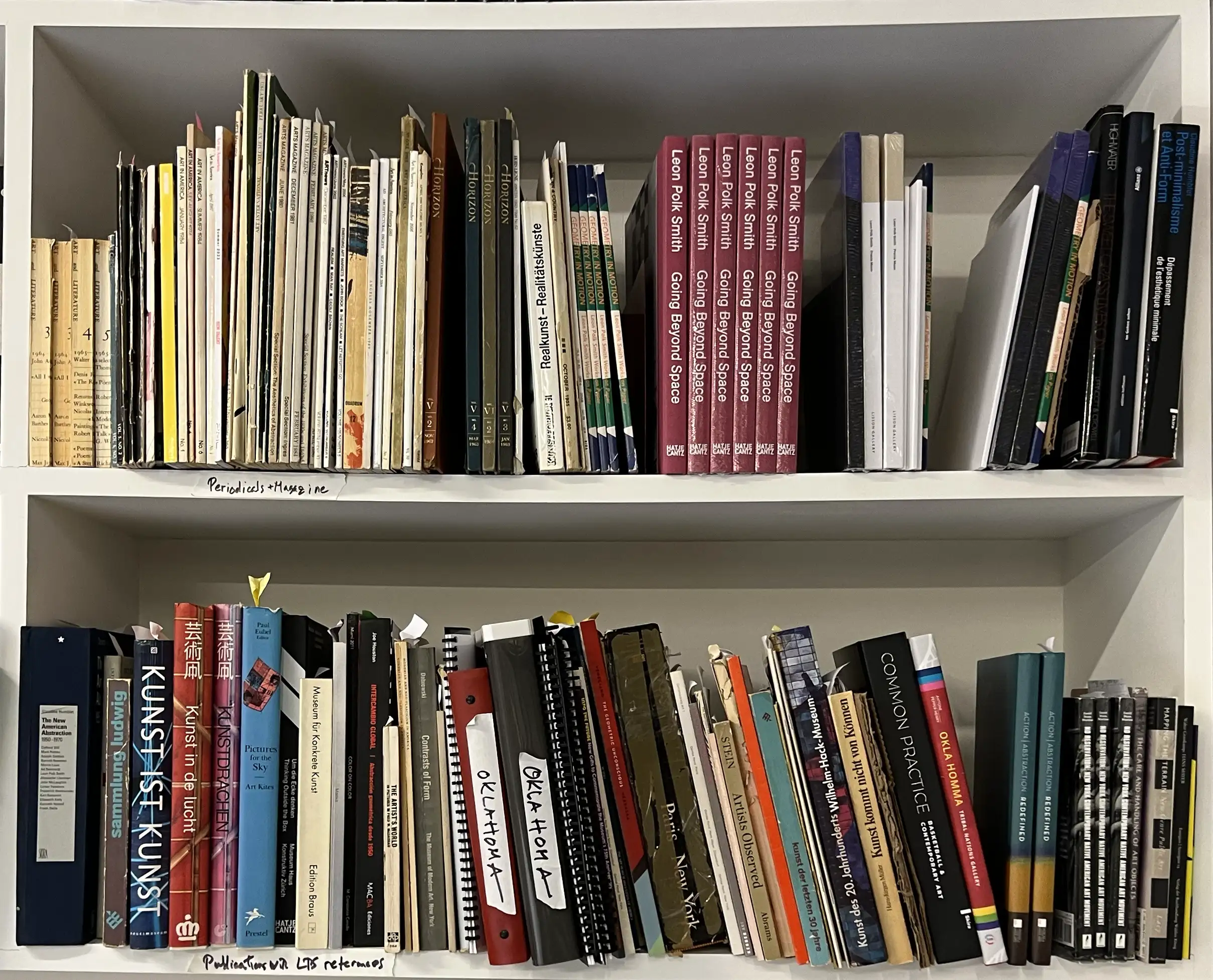 Many books on a shelf from Leon Polk Smith's library